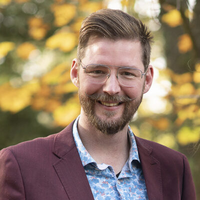 Portrait of Gijs van Bilsen, a white man with short brown hair and a beard.