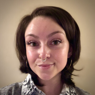 Portrait of Neeve MacGregor, a young white woman with dark hair.